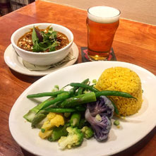 a vegetable platter with rice, a side of soup, and a pint of beer from Iron Springs Pub and Brewery in Fairfax