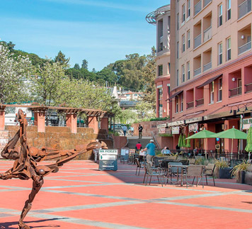 San Rafael town center, sculpture in foreground and restaurants in background, Magnolia Park Kitchen and Cold Stone Creamery.
