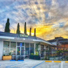 front of the Way Station restaurant in Fairfax at twilight